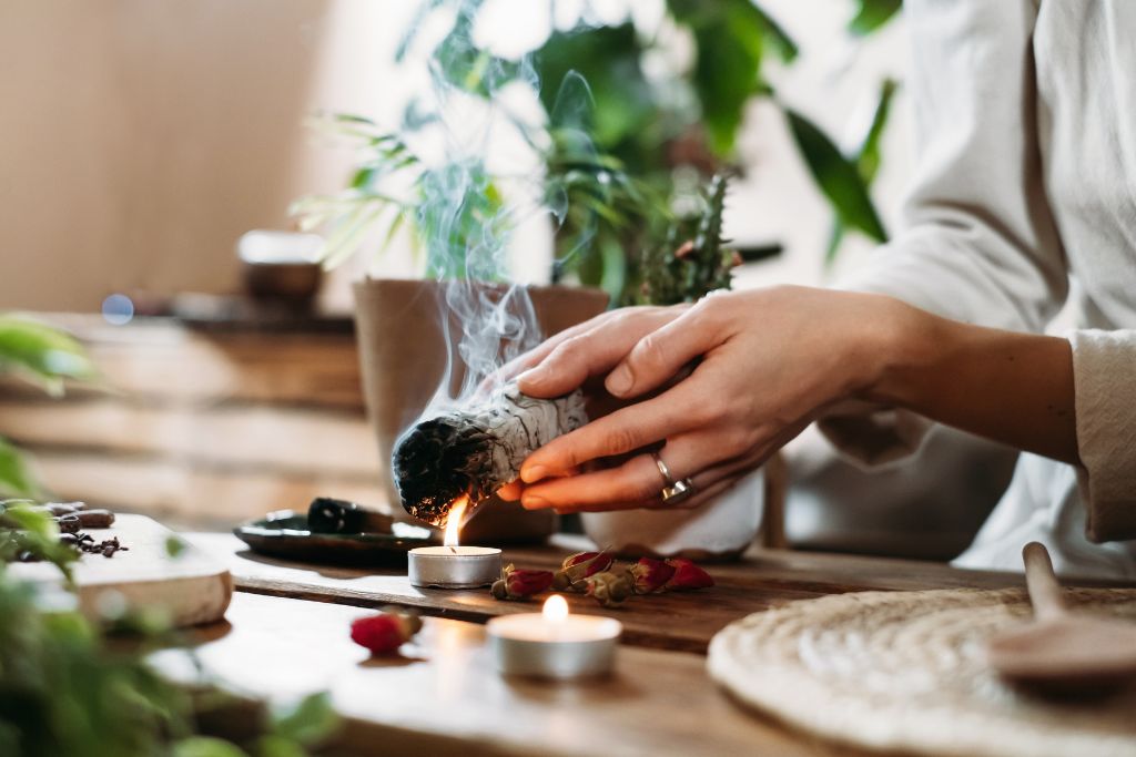 Herbs in Spirituality and a hand holding a herb