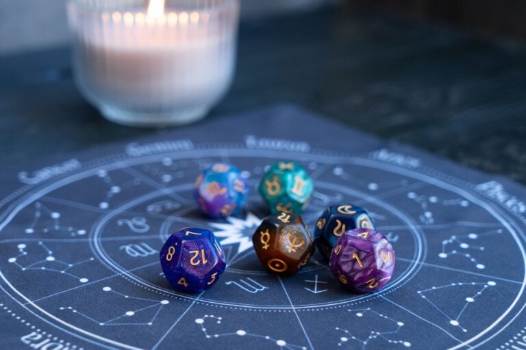 divination dice and candle on the table