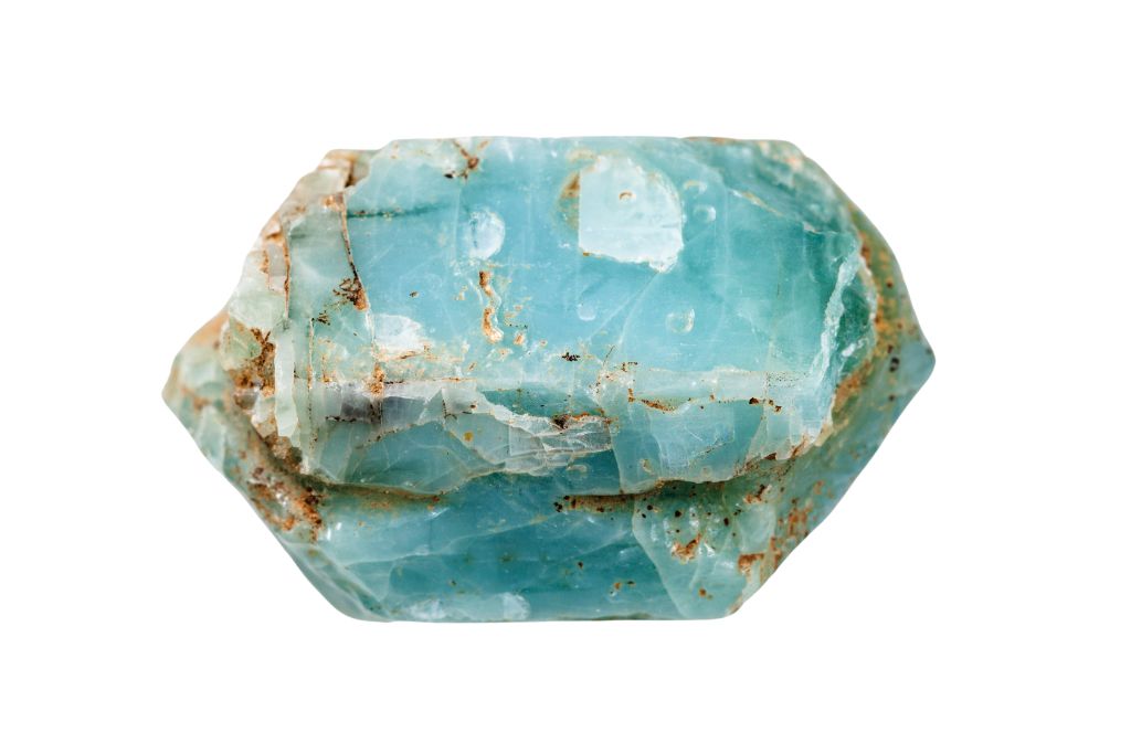 raw Blue Apatite on a white background