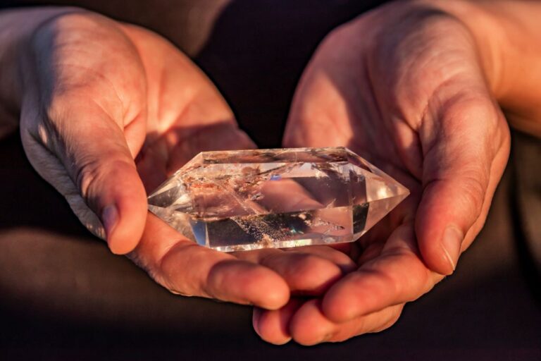 Hands holding a Terminated Crystal Quartz