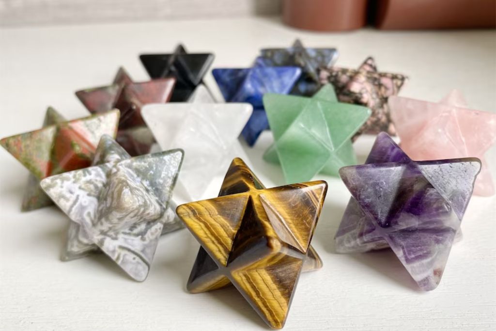 Merkaba star shaped crystals on a white table