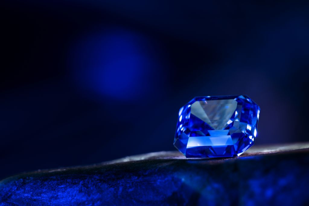 cornflower blue sapphire on blue blurry background