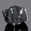 Schorl on a gray background