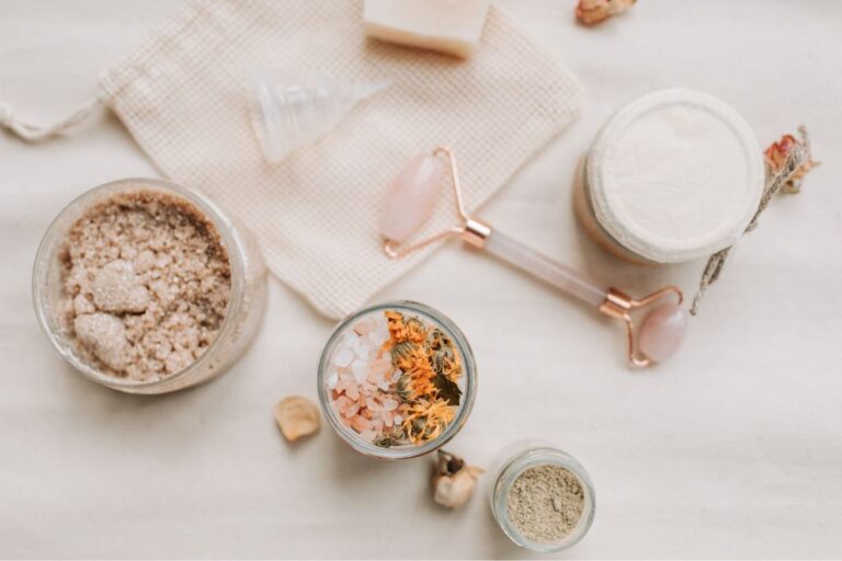 assorted beauty products on a cream backround