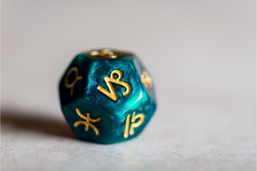 capricorn dice on cream background