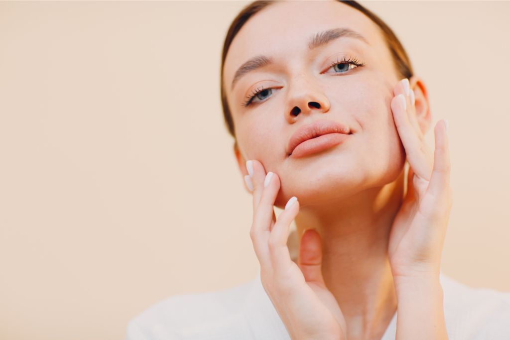 woman touching her face