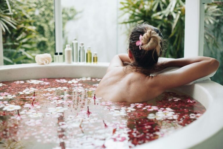 women in a spa bath filled with flowers