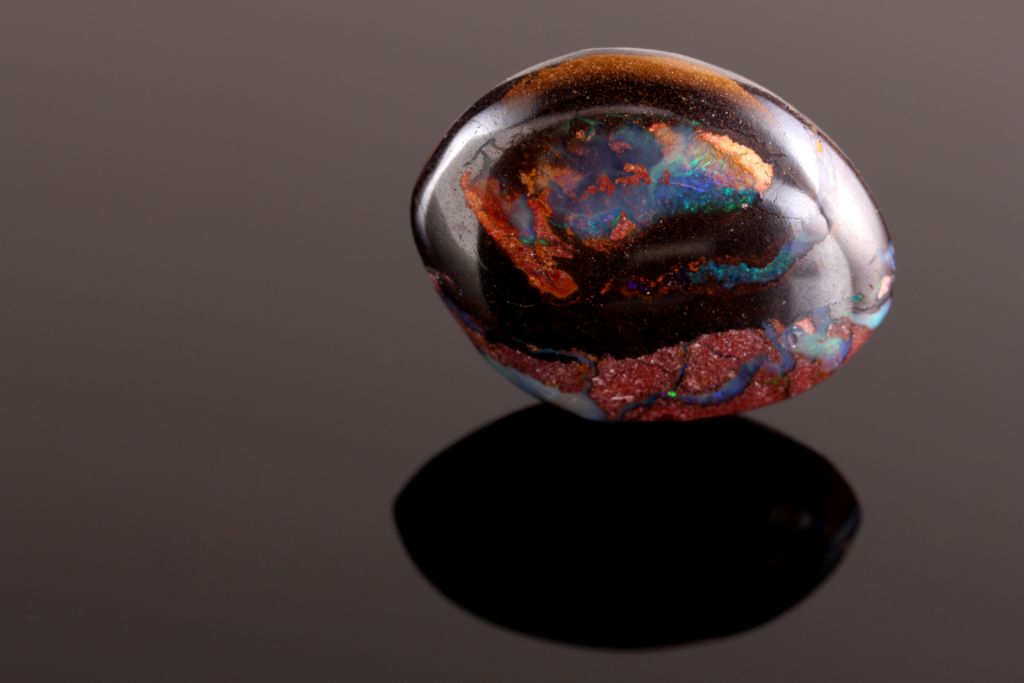 yowah nut boulder opal on glass table