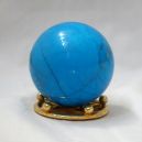 blue howlite crystal ball on gray table
